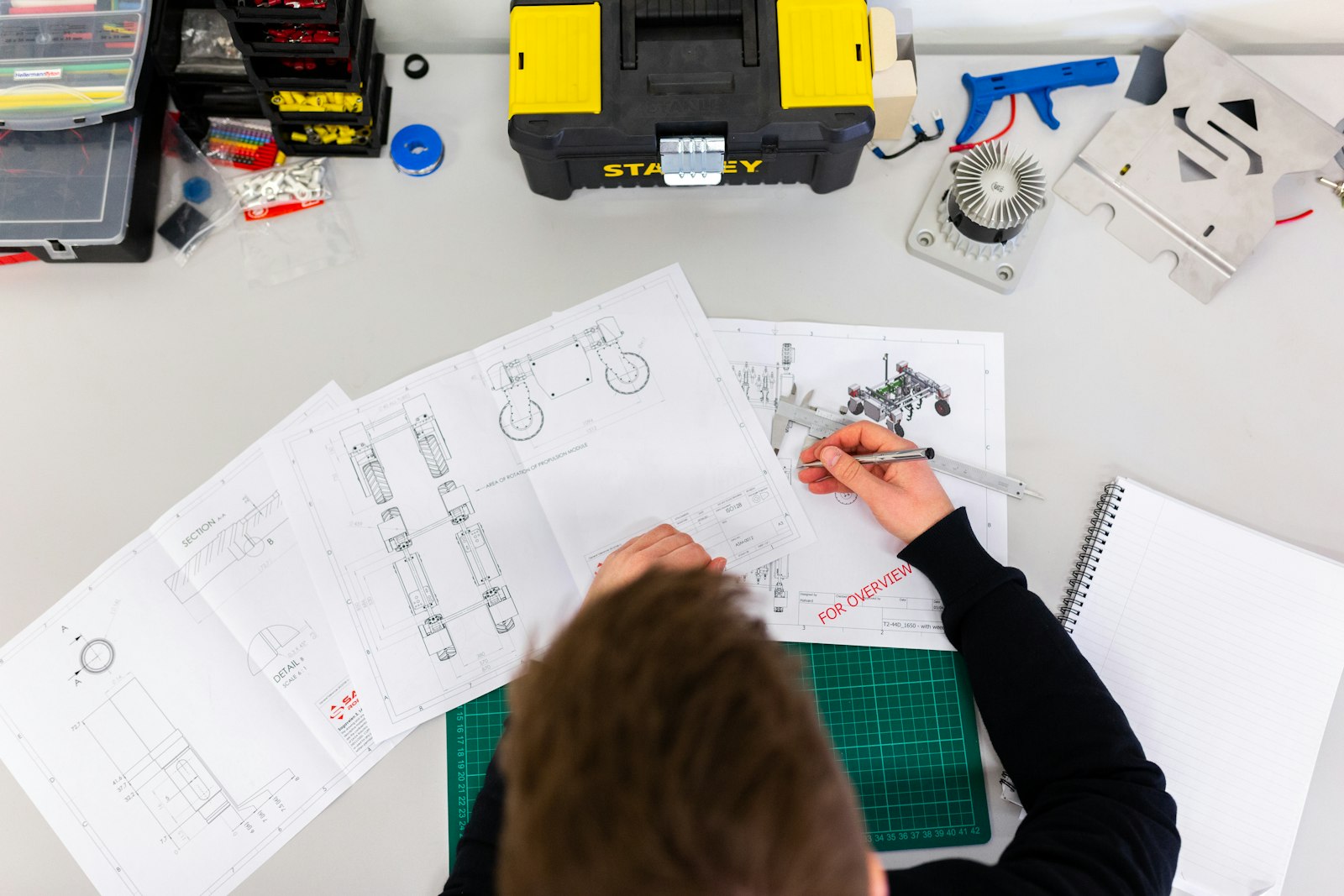 Engineer working on technical design drawings